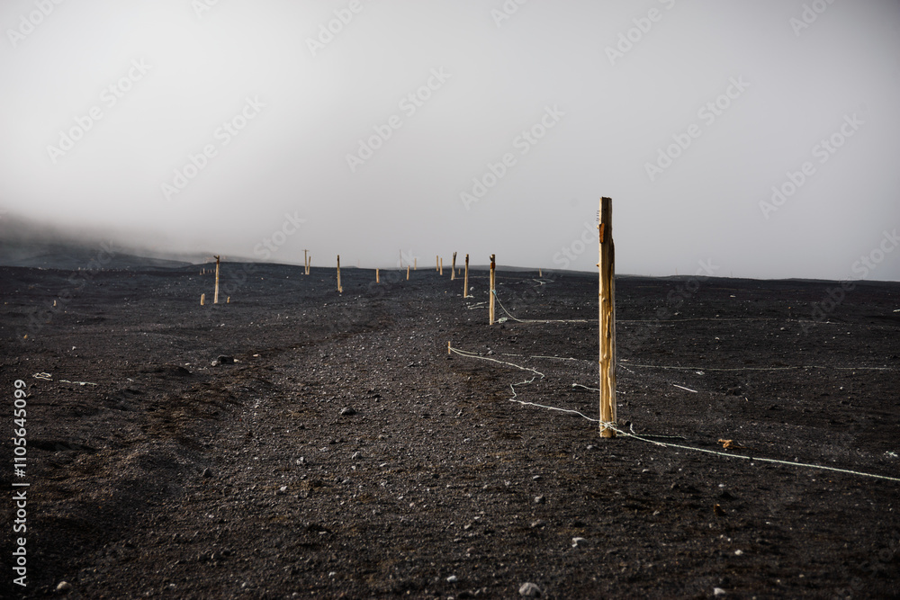 Hiking path in the ashes of Mount Fuji in a fog cloud, Honshu, Japan Hiking path in the ashes of Mount Fuji in a fog cloud, Honshu, Japan