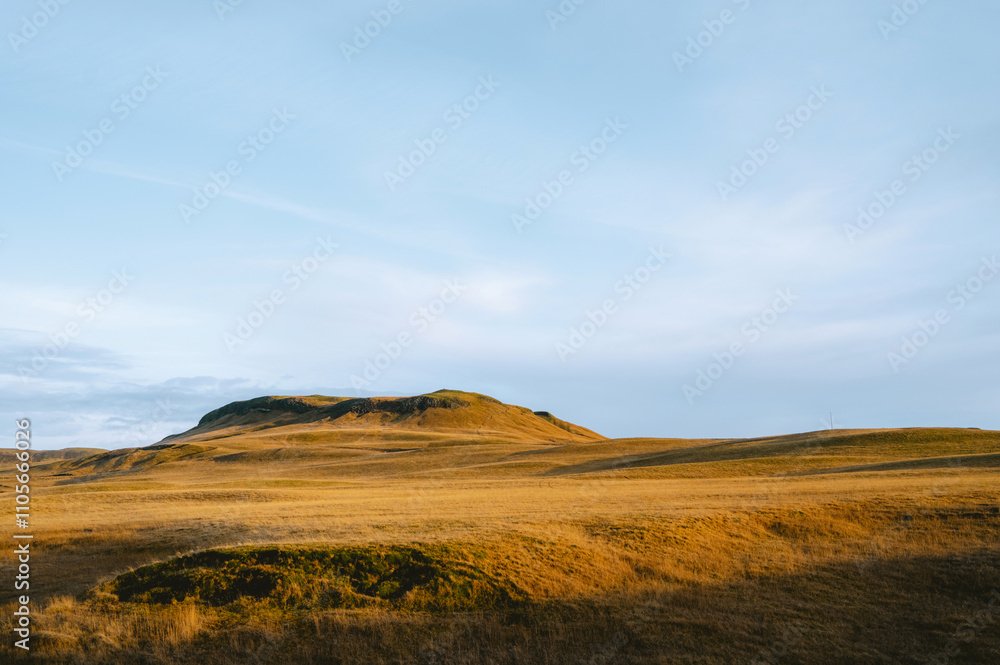 Icelandic minimalistic landscape. Beautiful autumn scenery. Green and yellow moss on hills. Cloudy sky. Icelandic minimalistic landscape. Beautiful autumn scenery. Green and yellow moss on hills. Cloudy sky.