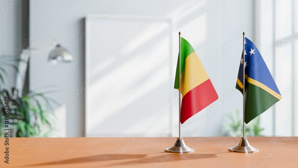 FLAGS OF MALI AND SOLOMON ISLANDS ON TABLE FLAGS OF MALI AND SOLOMON ISLANDS ON TABLE
