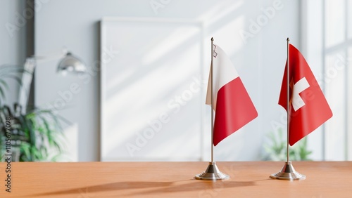 FLAGS OF MALTA AND SWITZERLAND ON TABLE photo