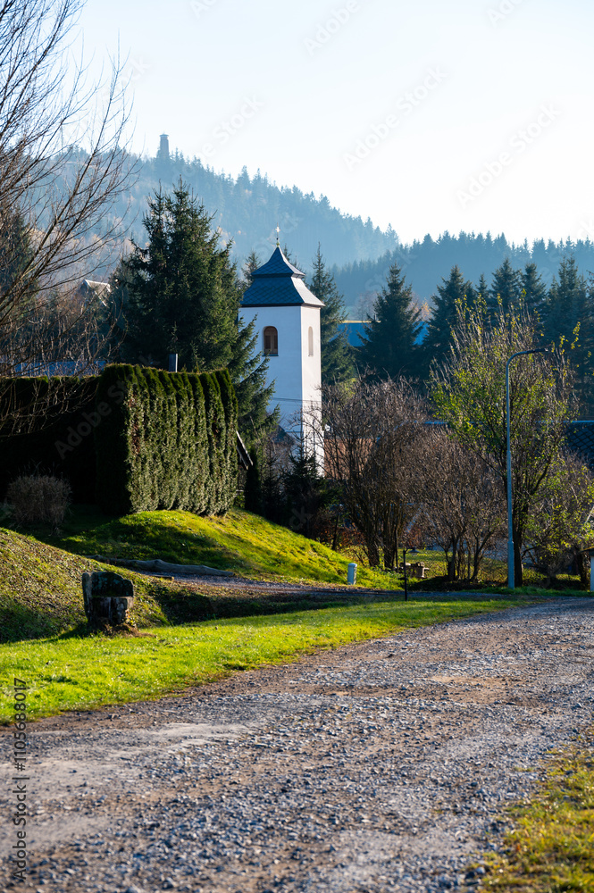A beautiful view of the Church of the Assumption of the Virgin Mary in the town of Sanov, showcasing its architectural elegance and peaceful presence in the surrounding area
