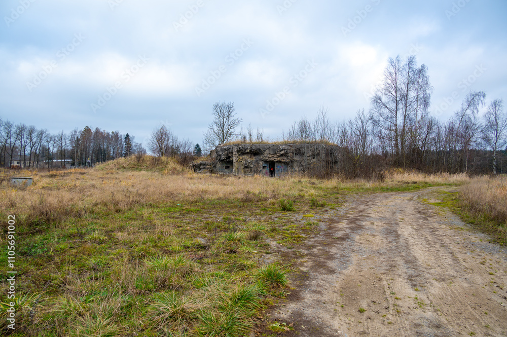 A historical image of a well-preserved infantry bunker near the town of Kraliky, showcasing its solid concrete structure and significance as a part of Czechoslovakia's wartime fortifications.