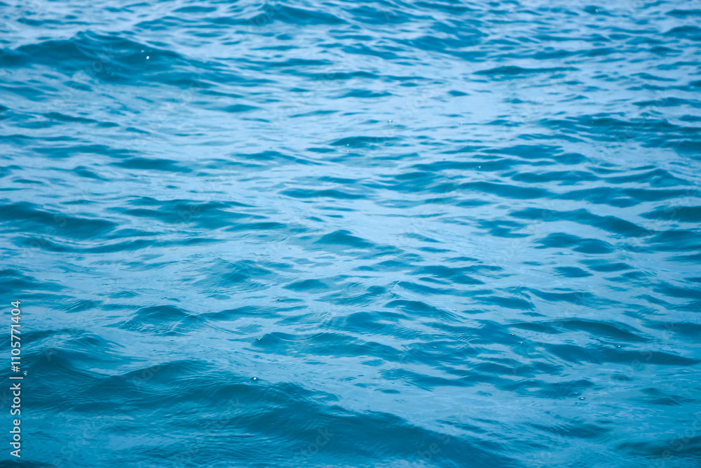 An abstract background of seawater flow under light exposure