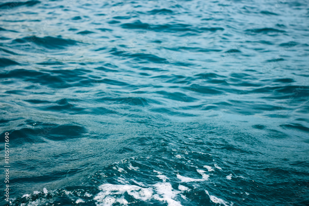 Fototapeta premium An abstract background of seawater flow under light exposure