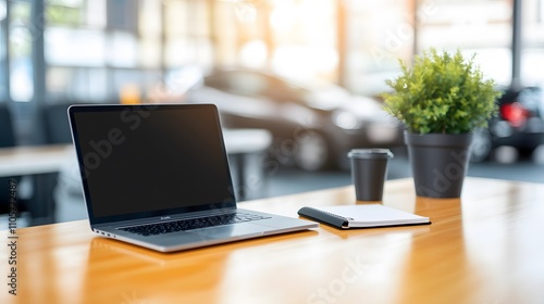 Wallpaper Mural Minimalist workspace with a single laptop, notebook, and a calming plant nearby Torontodigital.ca
