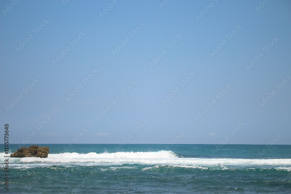 Soft waves of blue sea with foam on golden white sandy beach. Wave background Soft waves of blue sea with foam on golden white sandy beach. Wave background