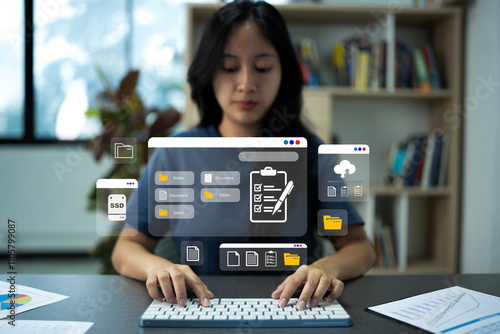 Hand typing on keyboard to download file from database server document management system in online documentation.