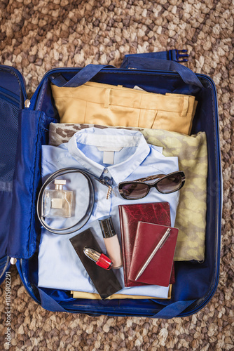 Packed Suitcase with Travel Essentials  photo