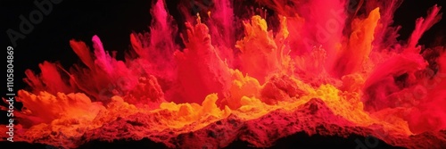 a vibrant explosion of red and orange powder against a black background. The colors blend and swirl together, creating a dynamic and fiery appearance, reminiscent of a burst of flames photo