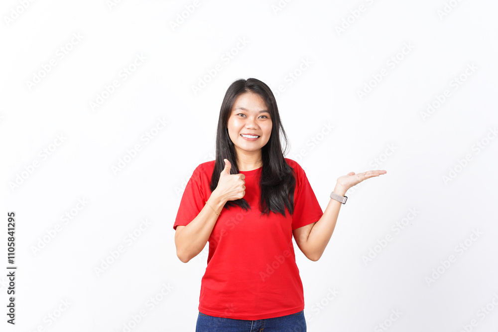 Presenting and Showing Product on Open Palm With Thumbs up Of Beautiful Asian Woman wearing red shirt Isolated On White Background Presenting and Showing Product on Open Palm With Thumbs up Of Beautiful Asian Woman wearing red shirt Isolated On White Background