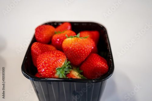 New spring harvest, one box of ripe Dutch red sweet strawberry on farmer market in the Netherlands