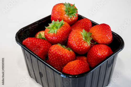 New spring harvest, one box of ripe Dutch red sweet strawberry on farmer market in the Netherlands