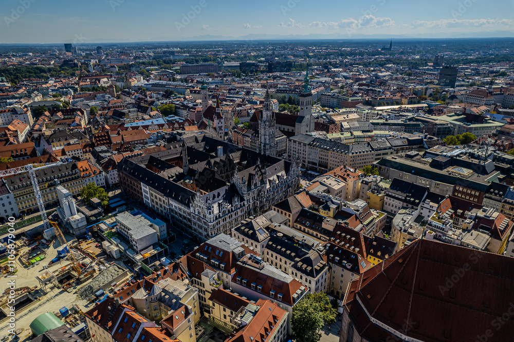 Fototapeta premium Beautiful aerial footage of Marienplatz the magestic New Town Hall, its clock and the Frauenkirche gothic church in the City of Munich Babaria Germany