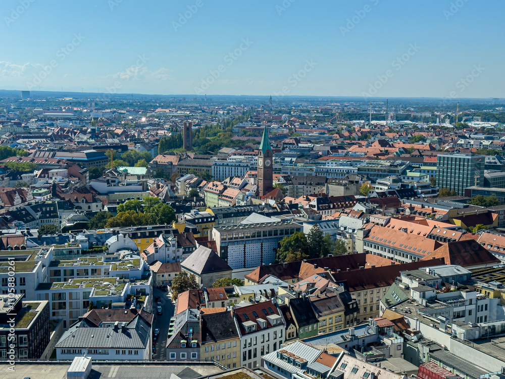 Fototapeta premium Beautiful aerial footage of Marienplatz the magestic New Town Hall, its clock and the Frauenkirche gothic church in the City of Munich Babaria Germany