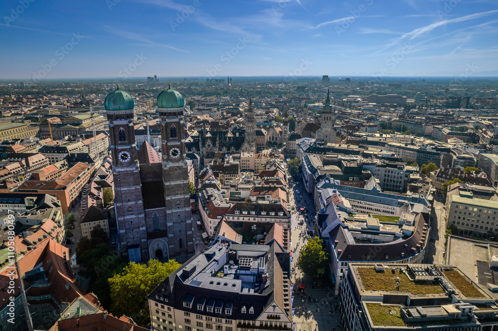 Fototapeta premium Beautiful aerial footage of Marienplatz the magestic New Town Hall, its clock and the Frauenkirche gothic church in the City of Munich Babaria Germany
