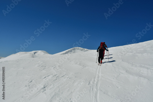 Climbing Llaima Vulcano with ski toptouring strong wind storm Chile