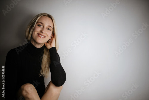 Smiling Woman with Black Turtleneck photo