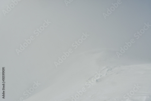 puyehue summit views in winter white out snow storm wind photo