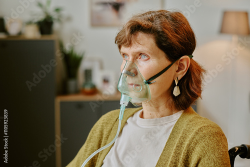 Elderly woman wearing oxygen mask sitting in a cozy home setting, surrounded by household items and plants creating a warm atmosphere