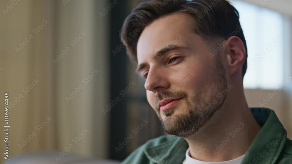 User hand holding smartphone at home closeup. Relaxed man watching cellphone User hand holding smartphone at home closeup. Relaxed man watching cellphone