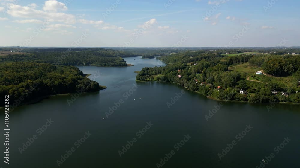 The Lake Ostrzyckie is located in the most attractive part of the Kashubian Landscape Park at the foot of Wiezyca and is part of the “Kolko Radunskie” waterway. The Kashubia district, Poland. The Lake Ostrzyckie is located in the most attractive part of the Kashubian Landscape Park at the foot of Wiezyca and is part of the “Kolko Radunskie” waterway. The Kashubia district, Poland.