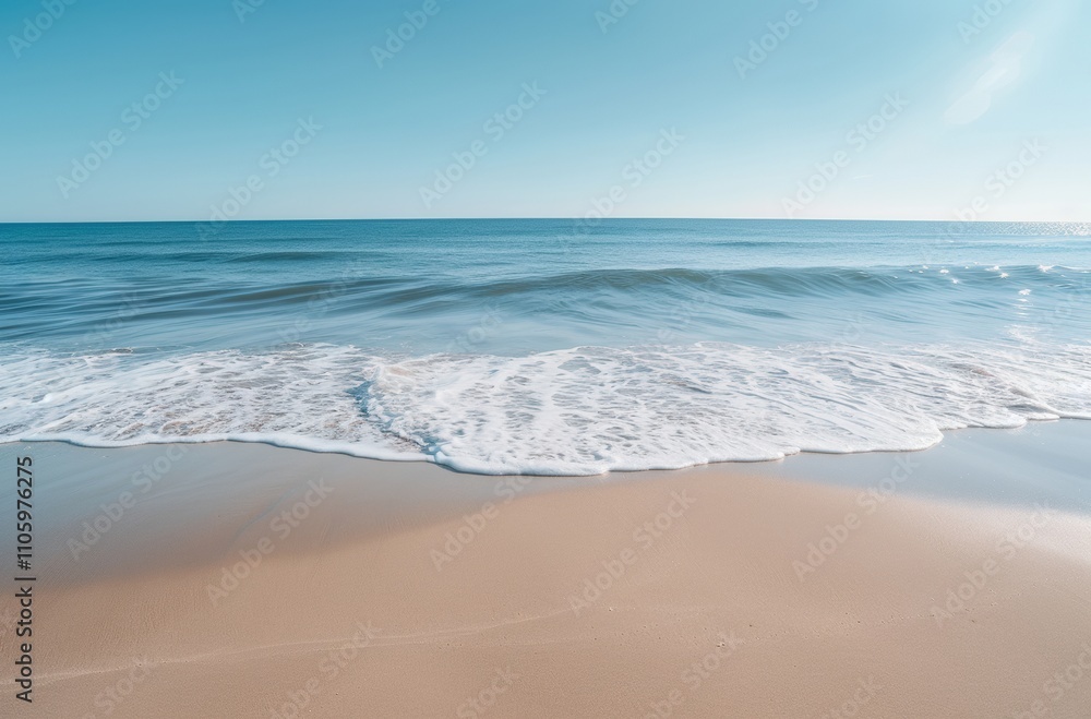 Calm beach scene with gentle waves and clear sky. Calm beach scene with gentle waves and clear sky.