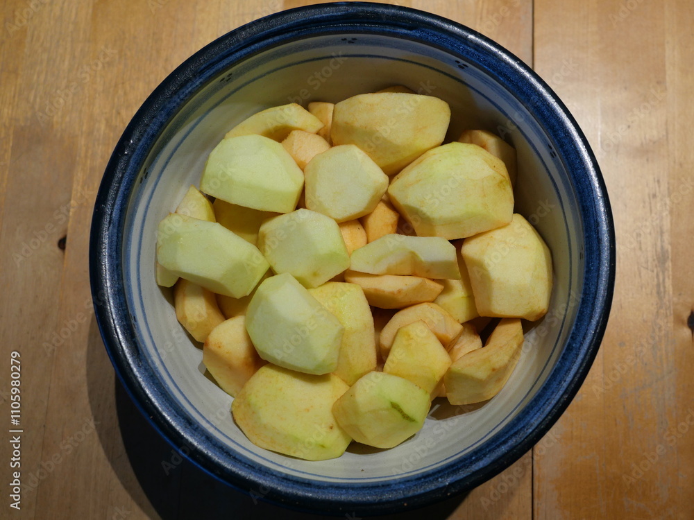 apple pieces peeled - A bowl full of apple pieces, ready to be made into delicious fall dishes. apple pieces peeled - A bowl full of apple pieces, ready to be made into delicious fall dishes.