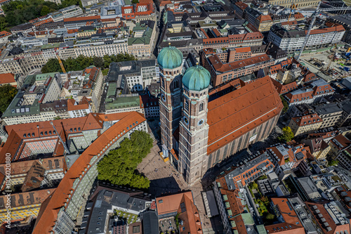 Beautiful aerial footage of Marienplatz the magestic New Town Hall, its clock and the Frauenkirche gothic church in the City of Munich Babaria Germany photo