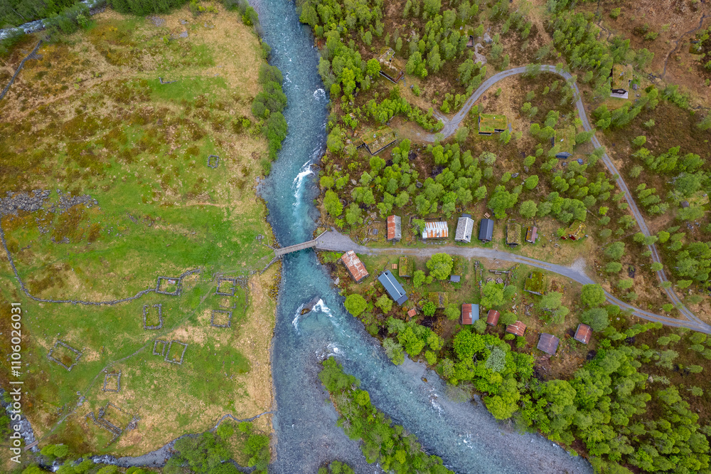 Fototapeta premium Old cabins by the flowing river