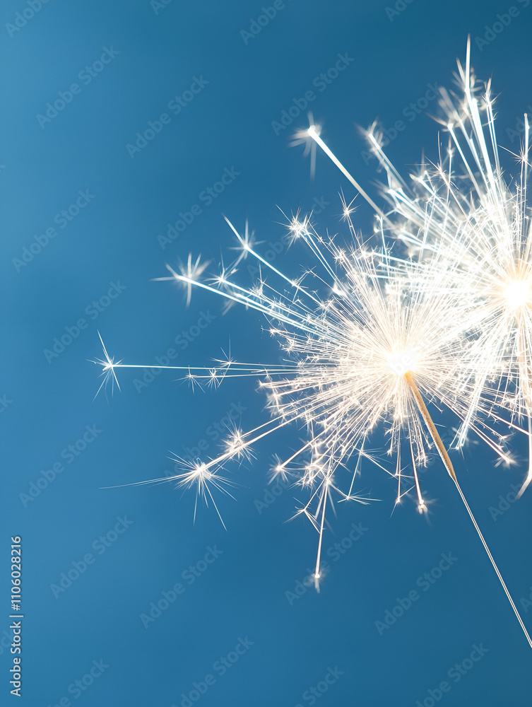 Obraz premium Sparkling silver fireworks on midnight blue backdrop.