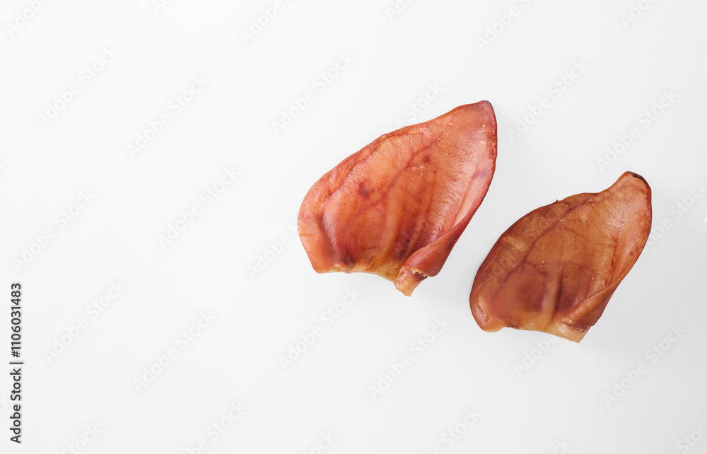 Natural chewable treats for pets. Dried Pig Ears for Dogs with copy space