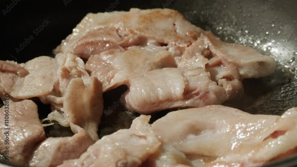 Frying pork bacon pork ham for ramen in pan side view close up, Fried slices of aromatic bacon frying pan for better cooking. Start day with traditional breakfast Frying pork bacon pork ham for ramen in pan side view close up, Fried slices of aromatic bacon frying pan for better cooking. Start day with traditional breakfast