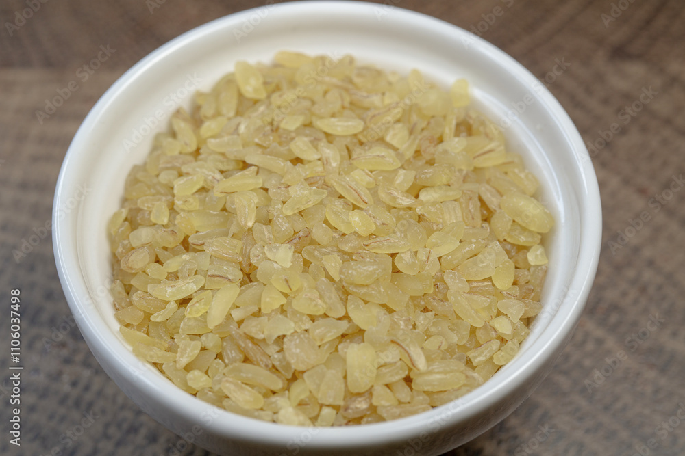Heap of raw bulgur close up. Bulgur texture macro. Heap of raw bulgur close up. Bulgur texture macro.
