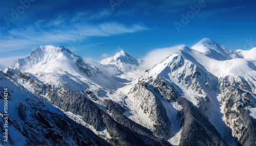 A breathtaking view of majestic mountain peaks blanketed in fresh snow, set against a clear blue sky, showcasing the beauty and tranquility of winter in nature.