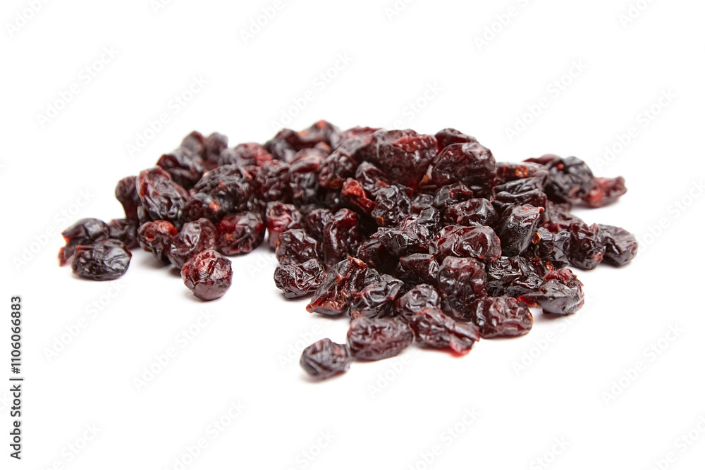 A scattered pile of dried cranberries with deep red hues and wrinkled textures, isolated on a white background. Ideal for snacks or culinary use A scattered pile of dried cranberries with deep red hues and wrinkled textures, isolated on a white background. Ideal for snacks or culinary use