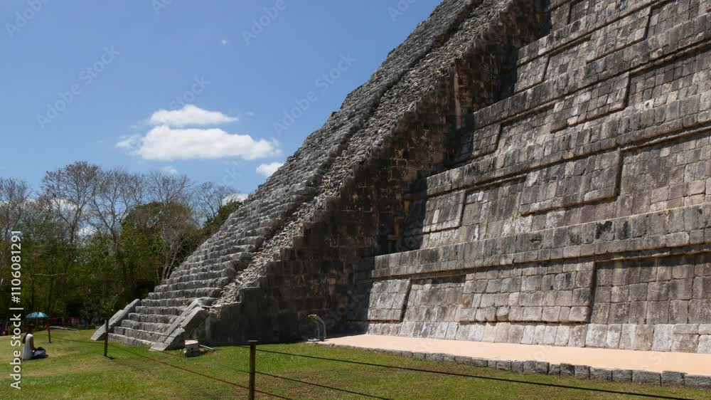 The Majestic Pyramid of Kukulcan at Chichén Itzá Under a Clear Blue Sky The Majestic Pyramid of Kukulcan at Chichén Itzá Under a Clear Blue Sky