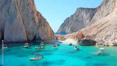 Motorboat Rentals Charter a Motor Yacht and explore Greece. Small pleasure fun boats on beach in Greek island of Zakynthos. Akra Keri Zante. Mizithres Rock