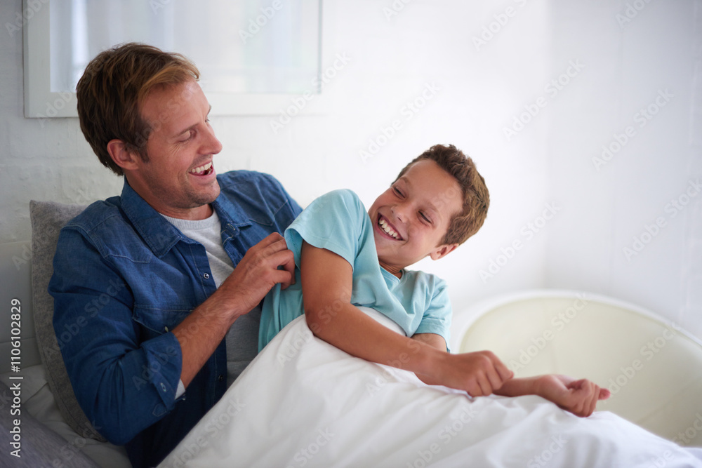 Father, son and tickle games in bed, laughing and playing together for love in relationship. Dad, boy and support happiness in child on weekend in family home, parent and funny humor for bonding Father, son and tickle games in bed, laughing and playing together for love in relationship. Dad, boy and support happiness in child on weekend in family home, parent and funny humor for bonding