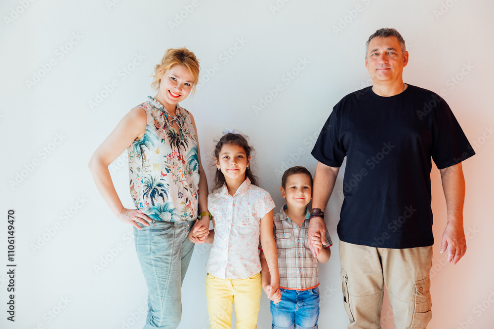 Family Photo of Mom, Dad, Son and Daughter on a White Background Family Photo of Mom, Dad, Son and Daughter on a White Background