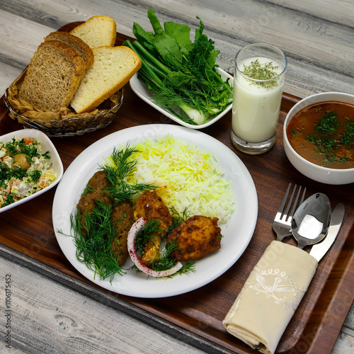 Business lunch for a business meeting. A dinner table consisting of meat, soup and vegetables photo