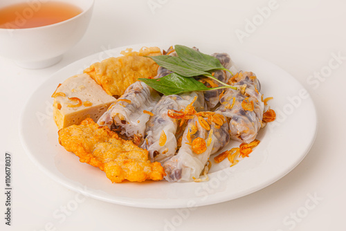 Banh Cuon Cha Muc Ha Long, vietnamese steamed rice paper rolls with minced meat inside and squid cake , Vietnamese food isolated on white background, close-up view photo