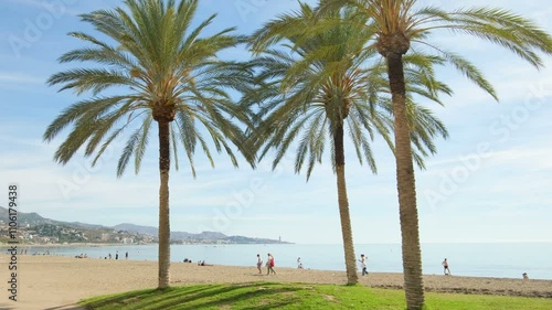 Tourists people walking on Malaga sea side beach during sunny day, Andalusia landmarks 4k