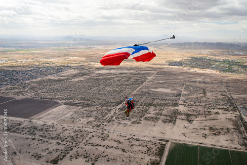 Parachute flying over desert field