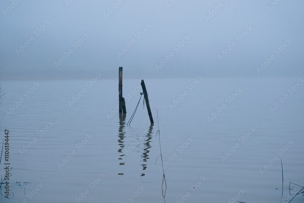 Scenic view of a lake during a foggy day during winter Scenic view of a lake during a foggy day during winter