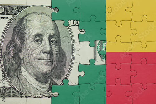 puzzle with the national flag of benin and the usa dollar money .finance concept