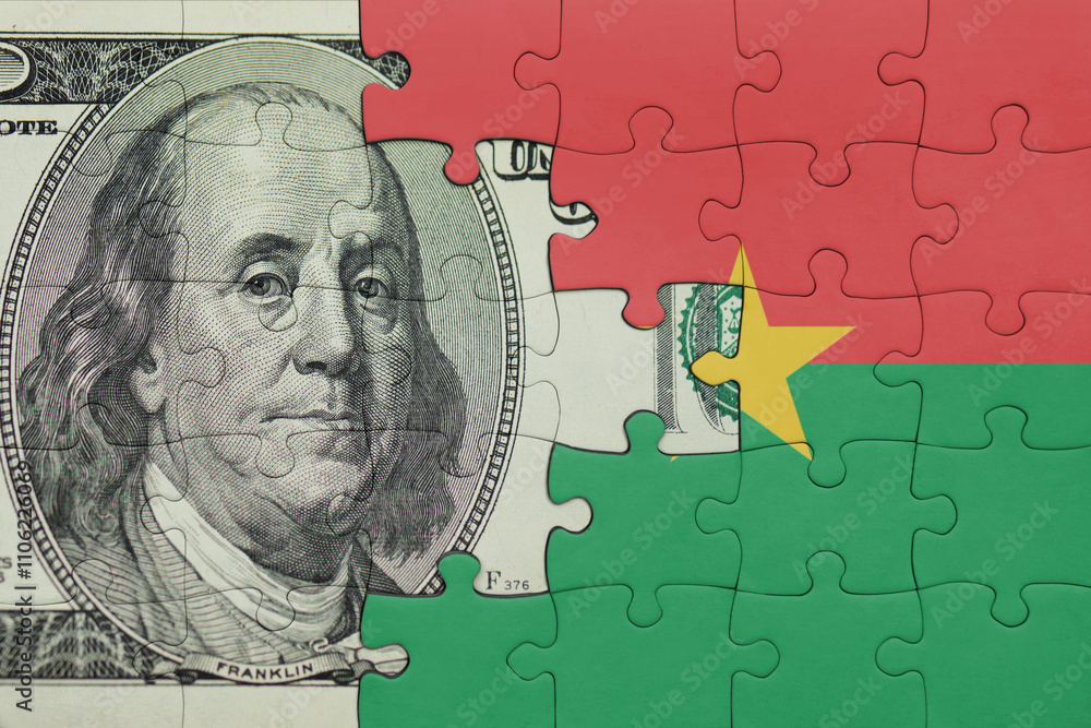 puzzle with the national flag of burkina faso and the usa dollar money .finance concept puzzle with the national flag of burkina faso and the usa dollar money .finance concept