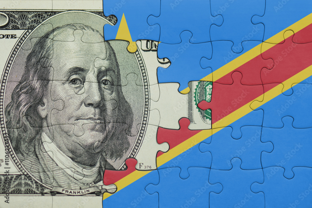 puzzle with the national flag of democratic republic of the congo and the usa dollar money .finance concept puzzle with the national flag of democratic republic of the congo and the usa dollar money .finance concept
