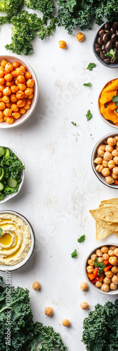 Vibrant display of healthy plant-based ingredients and fresh vegetables with hummus