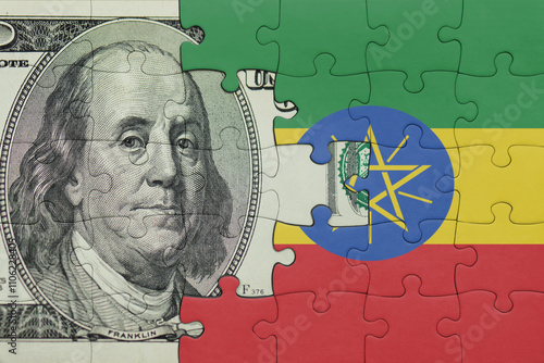Wallpaper Mural puzzle with the national flag of ethiopia and the usa dollar money .finance concept Torontodigital.ca