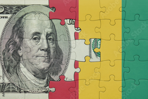 Wallpaper Mural puzzle with the national flag of guinea and the usa dollar money .finance concept Torontodigital.ca
